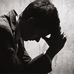 Man praying about workplace toxicity